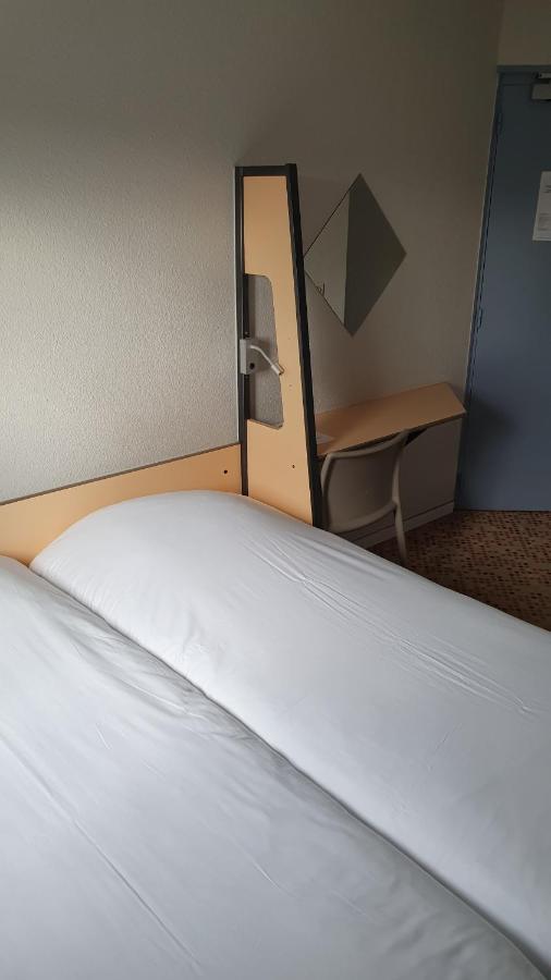 Welcomotel Coignieres Ruang foto